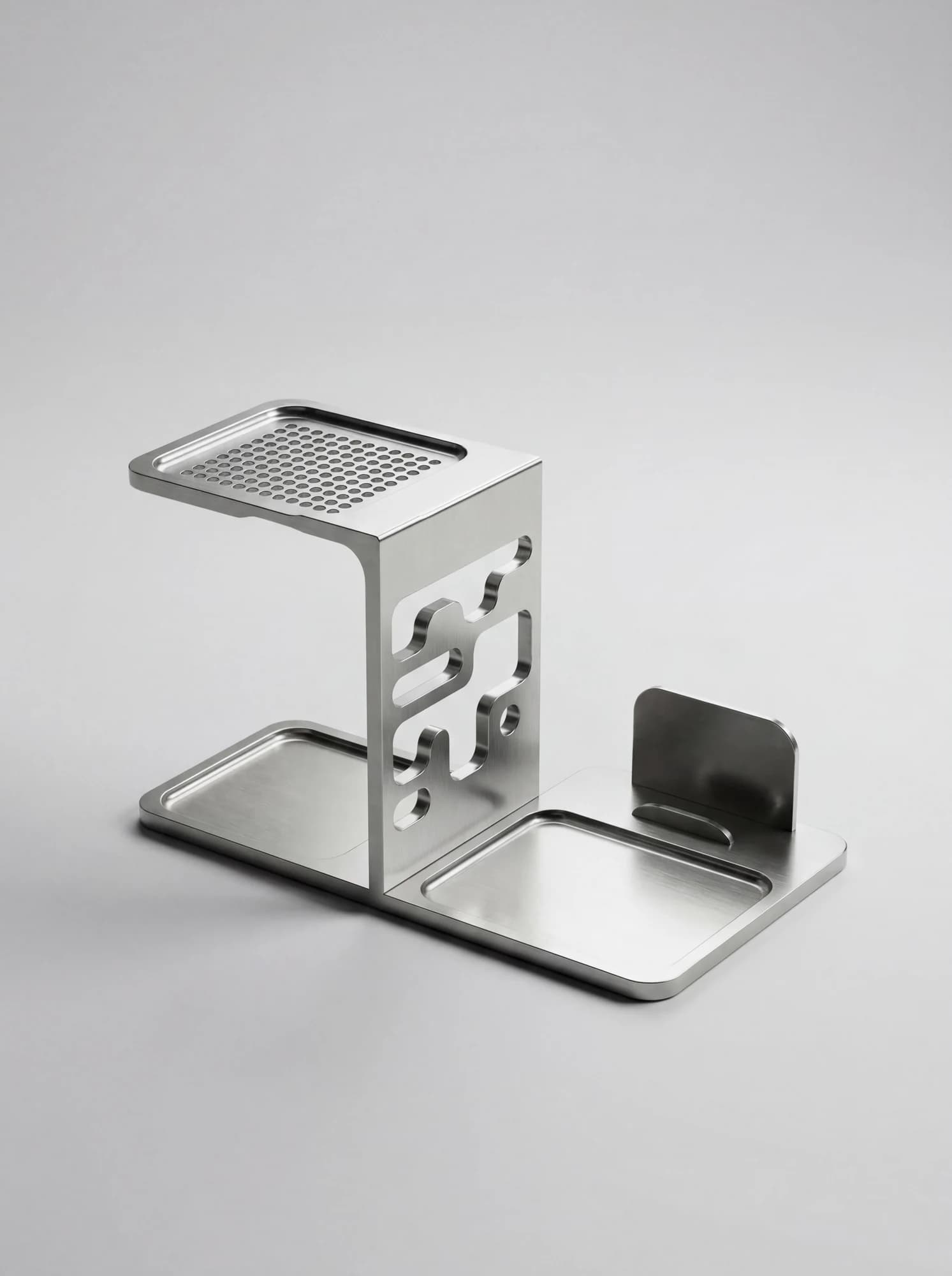 Silver desk organizer concept with a perforated top tray